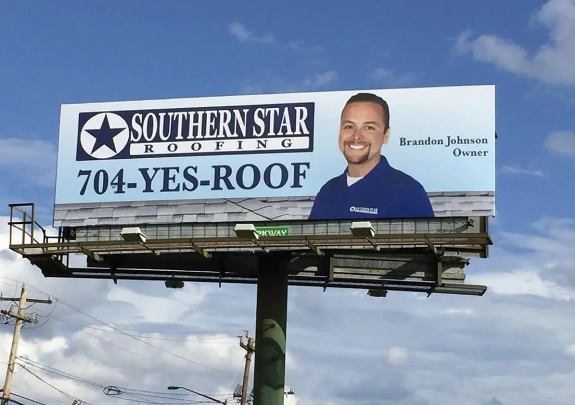 Southern Star Roofing highway billboard featuring owner Brandon Johnson — 704-YES-ROOF