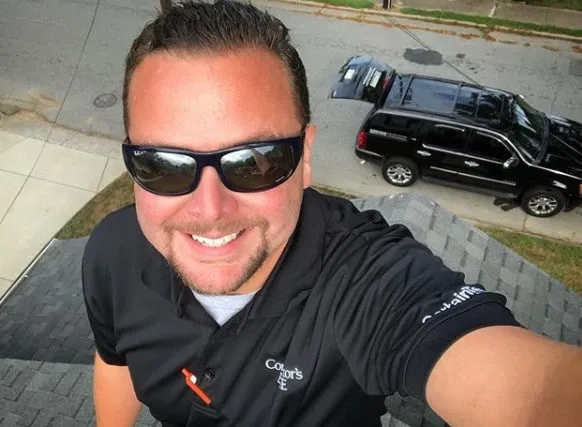 Brandon Johnson, owner of Southern Star Roofing, on a roof in Charlotte NC